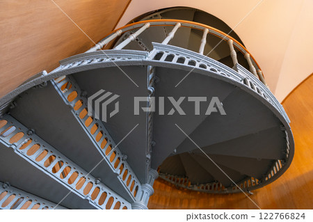 Bottom view of a spiral staircase made of cast iron painted in gray 122766824