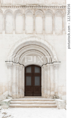 Old wooden door in white stone wall of Dormition Cathedral, Vladimir Old wooden door in white stone wall of Dormition Cathedral, Vladimir 122766856