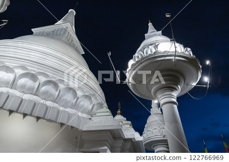 White domes of the Mahamevnawa Amawatura Monastery at night 122766969