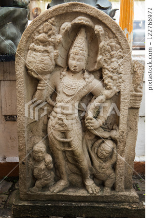 Ancient stone statue at Gangaramaya Temple 122766972