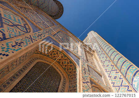 Exterior of Ulugh Beg Madrasah under blue sky on a sunny day 122767015
