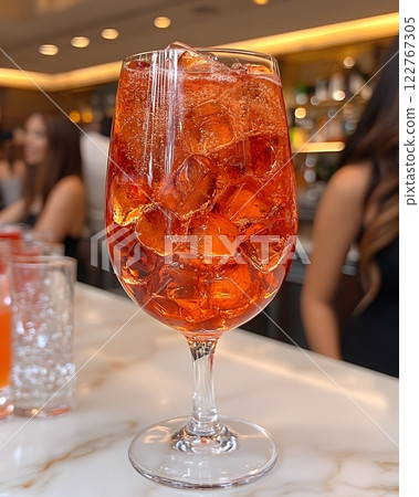 Cocktails are popular drinks at parties and bars, with different concoctions created to bring out their unique flavors and aromas. Some recipes are garnished with fruits, herbs to add visual appeal. 122767305