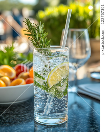 Cocktails are popular drinks at parties and bars, with different concoctions created to bring out their unique flavors and aromas. Some recipes are garnished with fruits, herbs to add visual appeal. 122767391