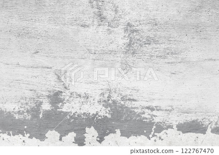 Grungy gray concrete wall with brush strokes of white paint 122767470