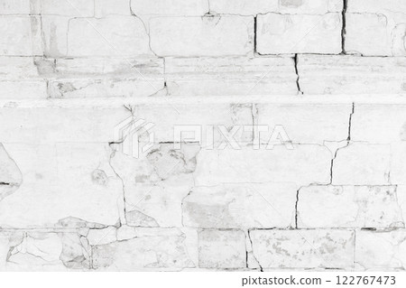 Old white brick wall with cracks, front view, close-up Old white brick wall with cracks, front view, close-up 122767473