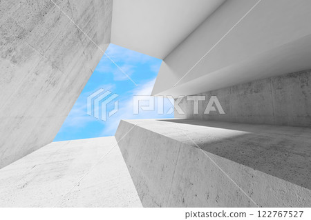Abstract empty white concrete interior with blue sky behind a window 122767527