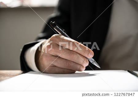 Signing an important document Signing an important document 122767847