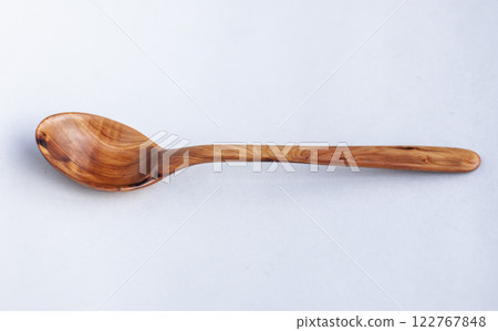 Wooden kitchen utensils stacked view close up isolated Wooden kitchen utensils stacked view close up isolated 122767848