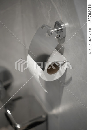 Toilet paper roll, perforated in restroom. WC Toilet paper roll, perforated in restroom. WC 122768016