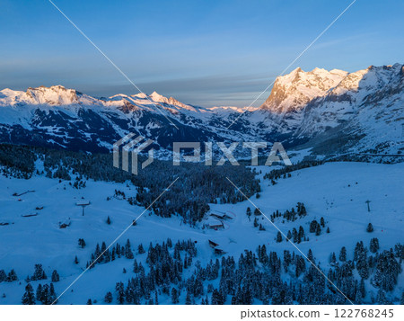 Wetterhorn Mountain at Sunset in Winter. Switzerland. Aerial View Wetterhorn Mountain at Sunset in Winter. Switzerland. Aerial View 122768245