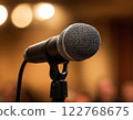 Professional microphone set up on stage with soft background lighting. Generated AI. 122768675