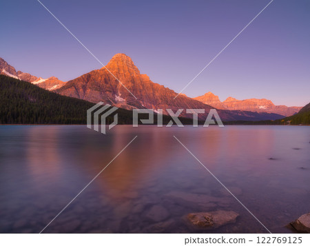 Mountains at dawn. Reflections on the surface of the water.  Nature. Lake and rocks 122769125