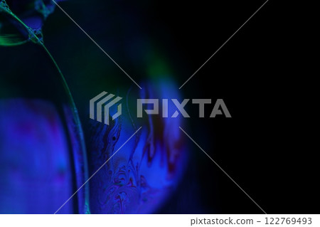Purple liquid pattern on black background, fluid surface, dark horror background, liquid in macro, fantastic smooth motion 122769493