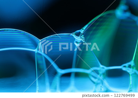 Blue and Green bubbles reflections on black background, liquid abstraction, colour waves, deep dark backgrounds, multicoloured glossy surface 122769499