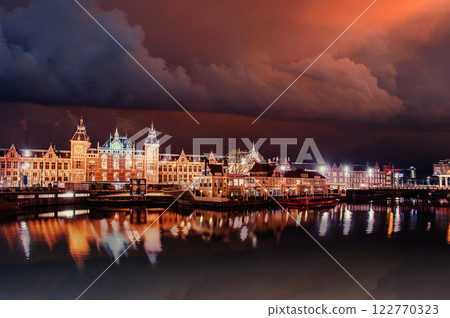 Beautiful night in Amsterdam. illumination of buildings Beautiful night in Amsterdam. illumination of buildings 122770323