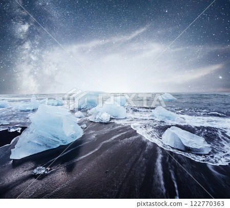 Icebergs floating in Jokulsarlon glacial lake. South Iceland. Lagoon. Starry sky night. Fantastic milky way. Icebergs floating in Jokulsarlon glacial lake. South Iceland. Lagoon. Starry sky night. Fantastic milky way. 122770363