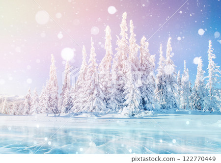 Mysterious winter landscape majestic mountains in winter. Magical winter snow covered tree. Photo greeting card. Bokeh light effect, soft filter. Mysterious winter landscape majestic mountains in winter. Magical winter snow covered tree. Photo greeting card. Bokeh light effect, soft filter. 122770449