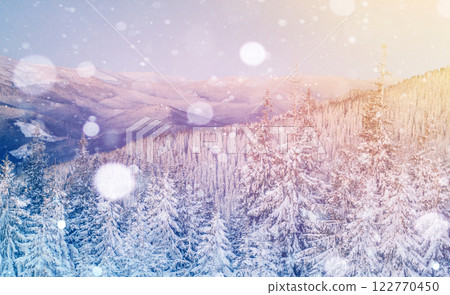 Mysterious winter landscape majestic mountains in winter. Magical winter snow covered tree. Photo greeting card. Bokeh light effect, soft filter. Mysterious winter landscape majestic mountains in winter. Magical winter snow covered tree. Photo greeting card. Bokeh light effect, soft filter. 122770450