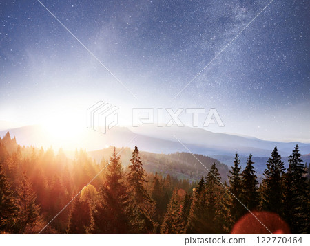 Mountain autumn landscape. High grass and vibrant night sky with stars and nebula and galaxy. Deep sky astrophoto 122770464
