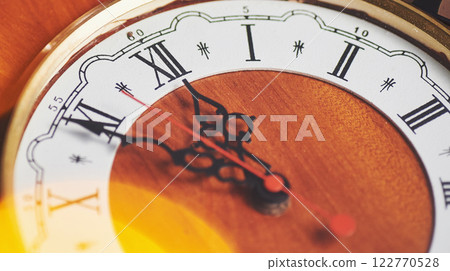 Happy New Year at midnight 2018, Old wooden clock with holiday lights 122770528