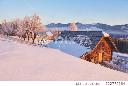 winter landscape trees and fence in hoarfrost, background with  snow flakes 122770664