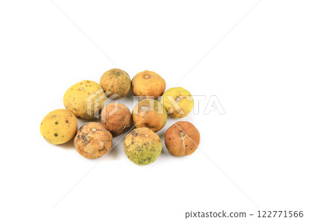 Yellow lemon shows signs of decay, with dark spots and shriveled skin, resulting from neglect and bacterial or fungal infection. Yellow lemon shows signs of decay, with dark spots and shriveled skin, resulting from neglect and bacterial or fungal infection. 122771566