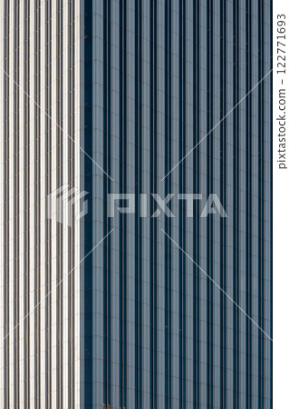 modern skyscraper with reflective glass and steel building exterior, contemporary architecture of big city 122771693