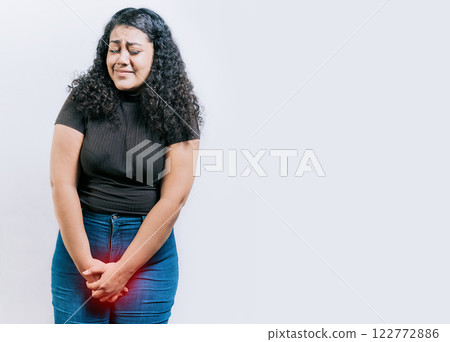 Young woman with urinary problems isolated. Girl with hands on crotch with urinary problems. People with urinary incontinence on white background 122772886
