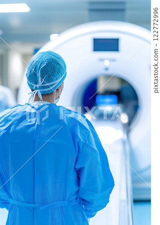 medical worker and MRI machine in a medical facility environment. 122772996