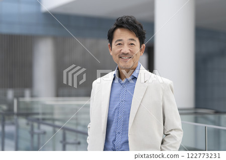 A man in his mid-50s smiling at the camera A man in his mid-50s smiling at the camera 122773231