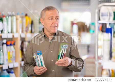 man buys toothbrushes 122774088