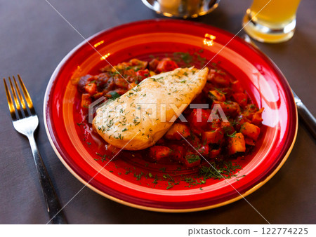 Chicken breast baked and served with stewed vegetables Chicken breast baked and served with stewed vegetables 122774225