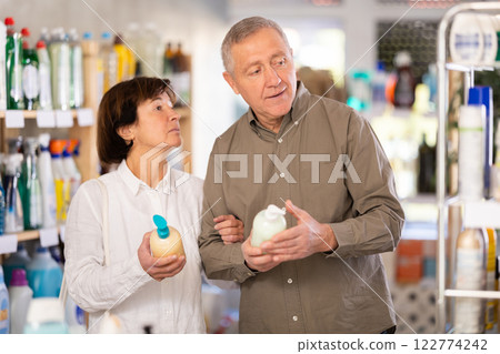 Couple man and woman choosing liquid soap in store 122774242