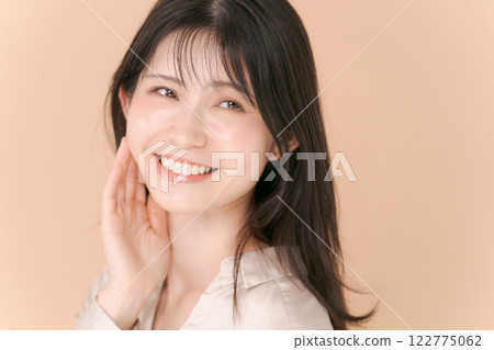 Portrait of a woman in her twenties wearing a shirt Portrait of a woman in her twenties wearing a shirt 122775062