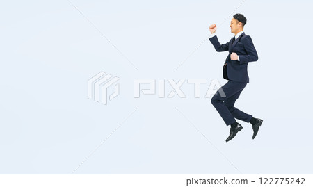 Full body photo of a middle-aged male business person jumping Full body photo of a middle-aged male business person jumping 122775242