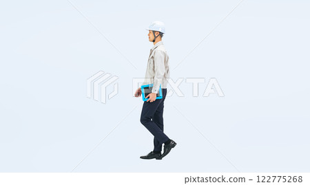 Full-body photo of a middle-aged man wearing work clothes walking 122775268