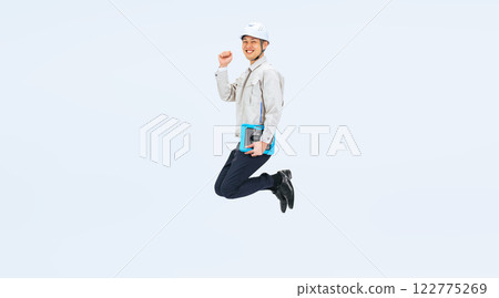 Full-body photo of a middle-aged man in work clothes jumping 122775269