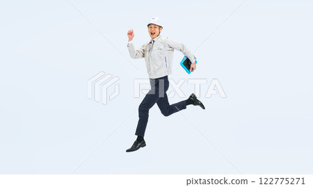 Full-body photo of a middle-aged man in work clothes jumping Full-body photo of a middle-aged man in work clothes jumping 122775271