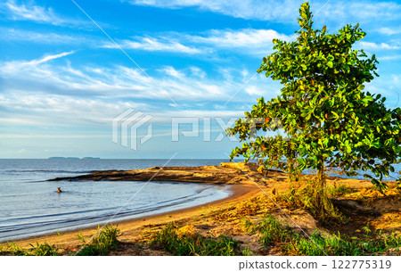 Cocoteraie Beach in Kourou at sunset in French Guiana, South America Cocoteraie Beach in Kourou at sunset in French Guiana, South America 122775319