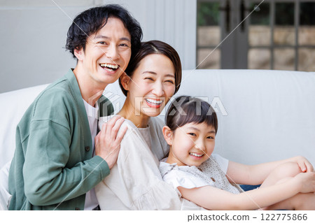 Family sitting on the sofa 122775866