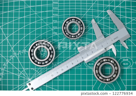 Precision Ball Bearings and Caliper in a Technical Measurement Environment 122776934