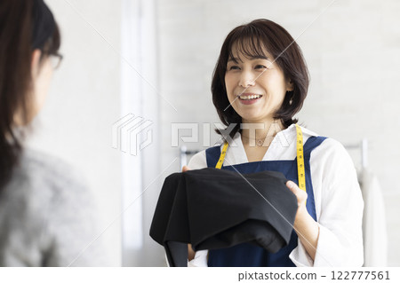 A woman serving customers A woman serving customers 122777561