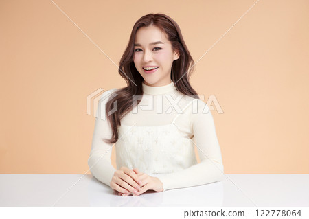 Beautiful young asian woman with clean fresh skin on beige background, Face care, Facial treatment, Cosmetology, beauty and spa, Asian women portrait. Beautiful young asian woman with clean fresh skin on beige background, Face care, Facial treatment, Cosmetology, beauty and spa, Asian women portrait. 122778064