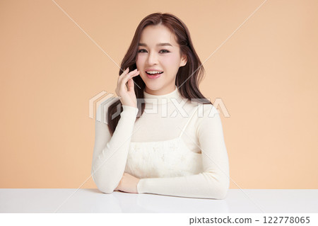Beautiful young asian woman with clean fresh skin on beige background, Face care, Facial treatment, Cosmetology, beauty and spa, Asian women portrait. Beautiful young asian woman with clean fresh skin on beige background, Face care, Facial treatment, Cosmetology, beauty and spa, Asian women portrait. 122778065
