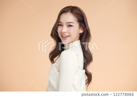Beautiful young asian woman with clean fresh skin on beige background, Face care, Facial treatment, Cosmetology, beauty and spa, Asian women portrait. 122778068
