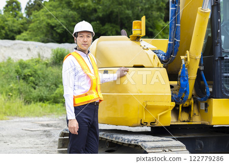 Workers working at a construction site Workers working at a construction site 122779286