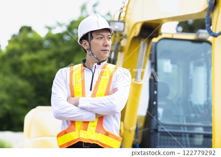 Workers working at a construction site Workers working at a construction site 122779292