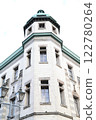 White Western-style building with green roof 122780264