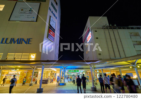 View towards the ticket gates from the pedestrian deck at the north exit of JR Yokohama Line Machida Station in Machida, Tokyo at night 122780480