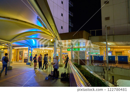 View towards the ticket gates from the pedestrian deck at the north exit of JR Yokohama Line Machida Station in Machida, Tokyo at night View towards the ticket gates from the pedestrian deck at the north exit of JR Yokohama Line Machida Station in Machida, Tokyo at night 122780481